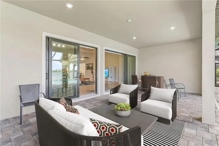 View of patio with an outdoor hangout area