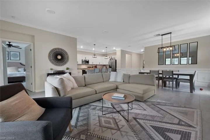 Living room featuring ornamental molding and recessed lighting