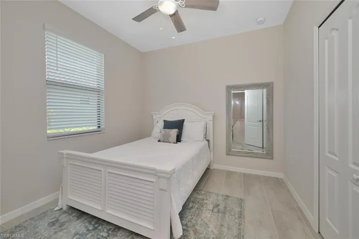 Bedroom featuring baseboards and a ceiling fan