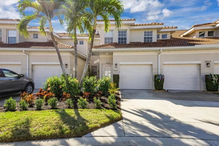 Mediterranean / spanish-style home featuring stucco siding, concrete driveway, a garage, and a tile roof