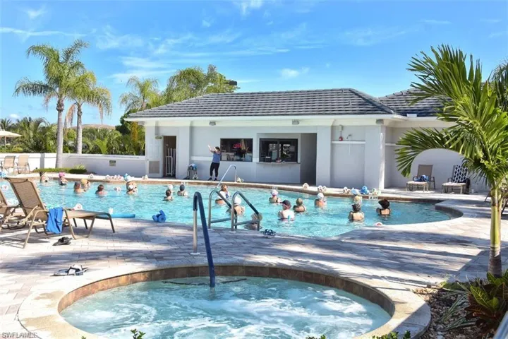 View of pool featuring a patio and a hot tub