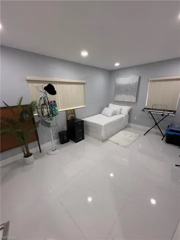 Bedroom with baseboards and recessed lighting