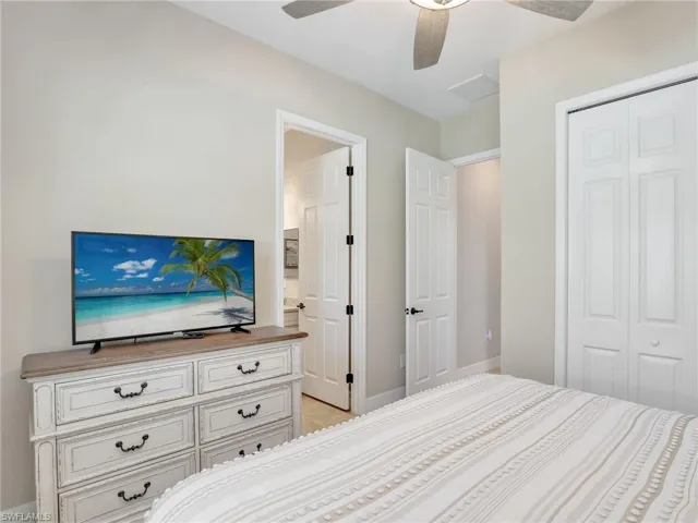 Bedroom with a closet and ceiling fan