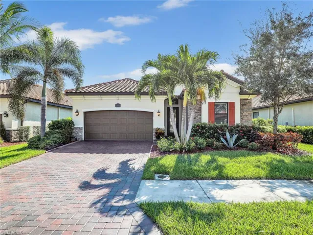 Mediterranean / spanish-style home featuring a garage