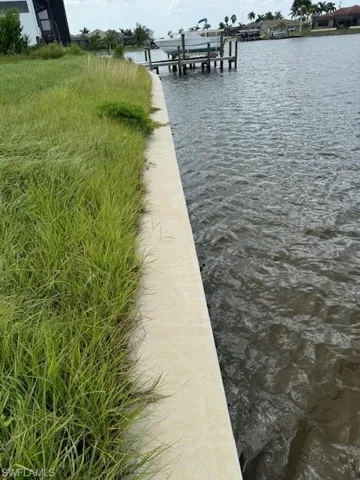 Dock featuring a water view and boat lift