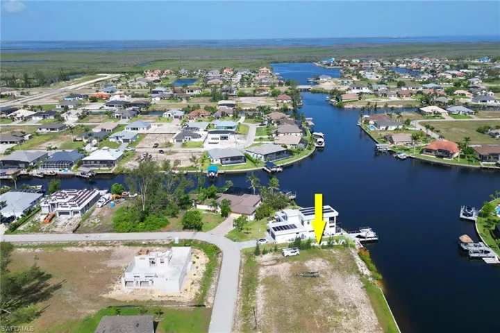 View of property location with nearby suburban area
