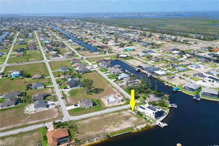 View of property location with nearby suburban area and a large body of water