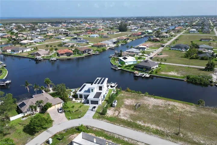 Aerial view of residential area with a large body of water