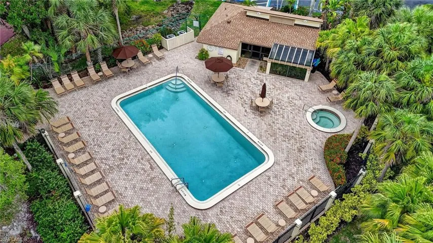 Rectangular swimming pool with integrated steps, surrounded by a paver deck