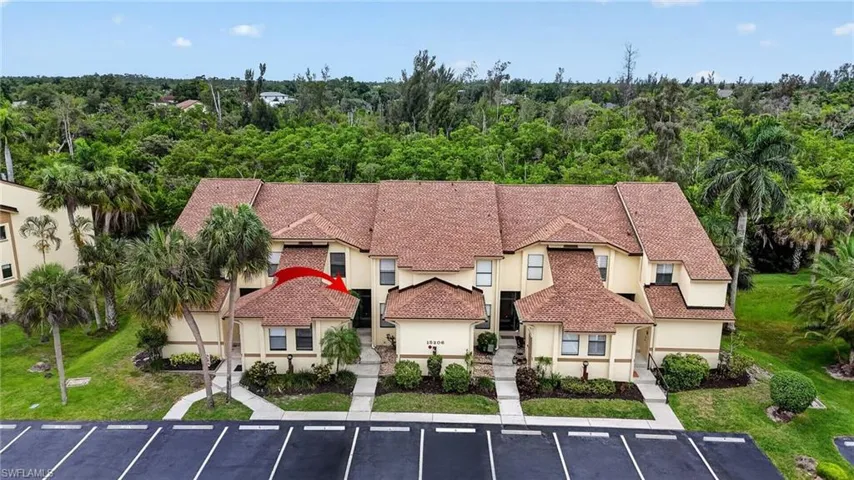 Mediterranean-inspired architecture featuring a terracotta-hued tile roof and stucco exterior