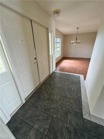 View from garage into home looking at front door / foyer