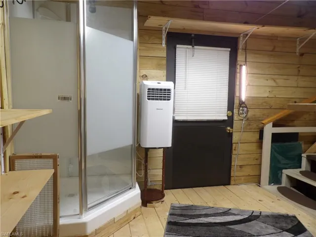 Extra Shower, a/c unit, clothes rack & shelving