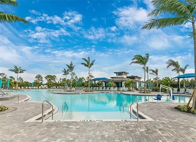 Community pool with a patio area