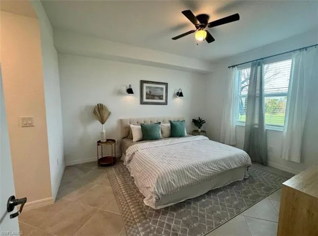 Bedroom featuring ceiling fan and light tile patterned floors