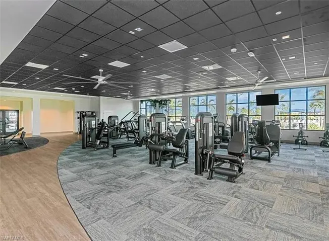 Gym with a paneled ceiling