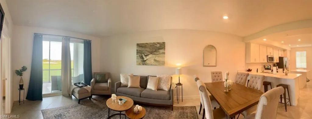 Living room featuring recessed lighting and light tile patterned floors