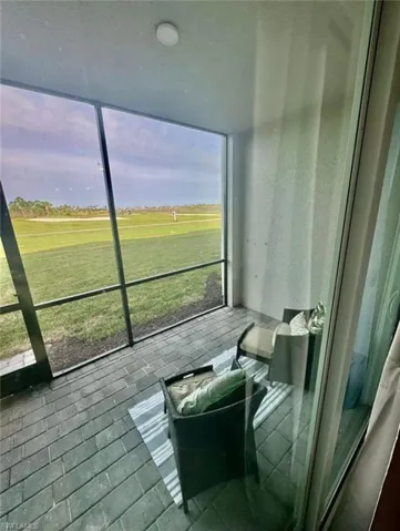 Sunroom with view of golf course