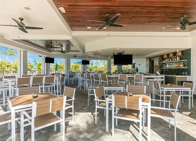 View of patio / terrace with ceiling fan and outdoor dining space