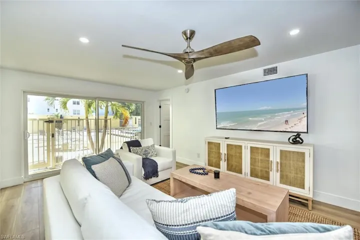 Comfortable and spacious Living Room overlooks pool area