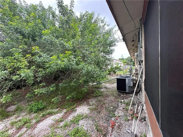 View of yard with cooling unit