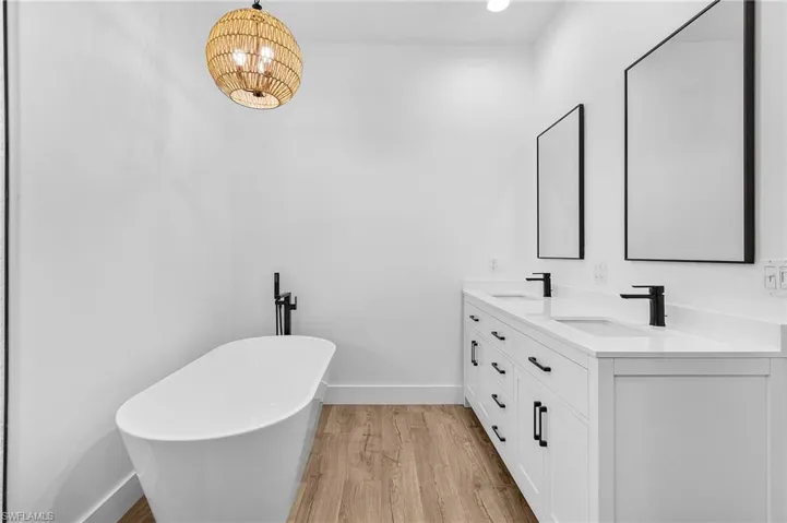 soaking tub, quartz countertops with double sink