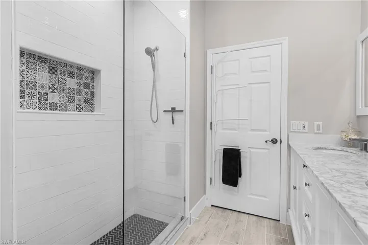 pool bath with walk in shower, quartz counter tops