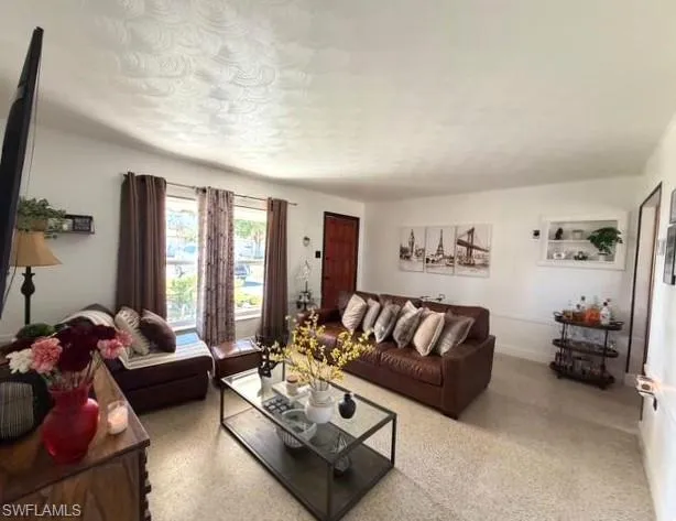 Living room featuring speckle patterned floor