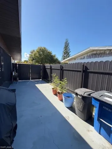 Fenced backyard with a patio