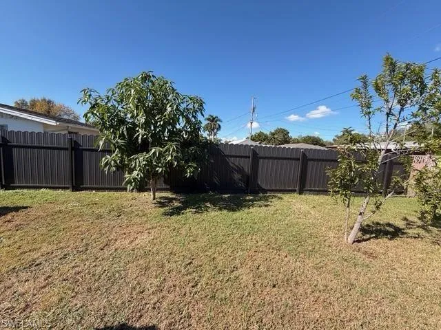 View of fenced backyard