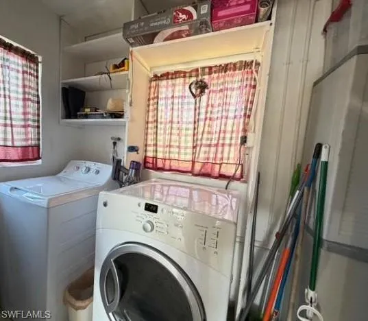 Laundry room featuring independent washer and dryer