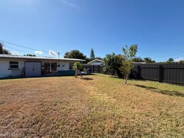 View of fenced backyard