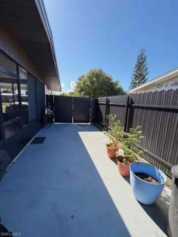 Fenced backyard featuring a patio area