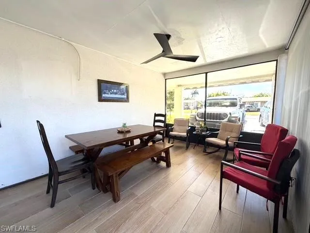 Dining area featuring light wood-style flooring and a ceiling fan