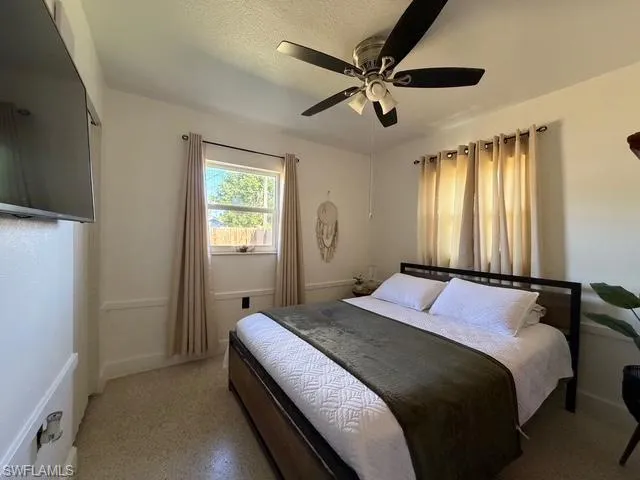 Bedroom featuring a ceiling fan