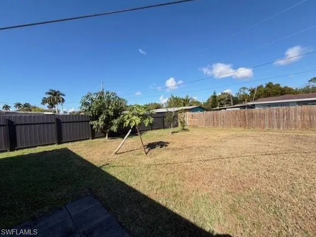 View of fenced backyard