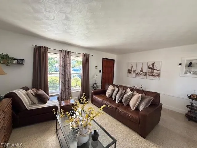 Living room featuring baseboards