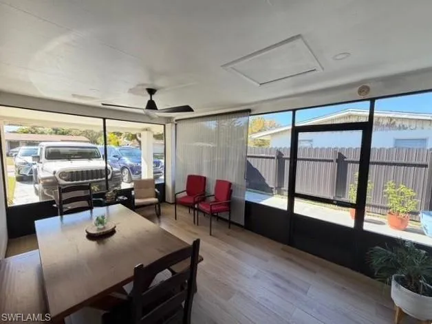 Sunroom with wood finished floors