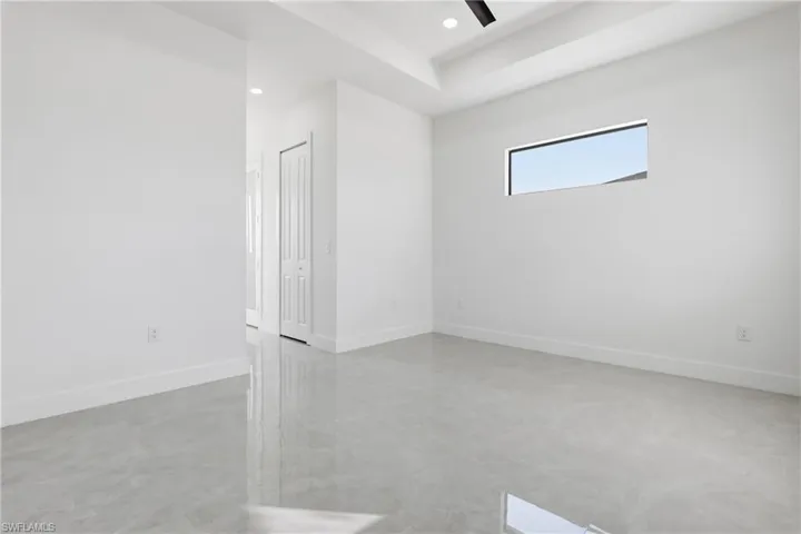 Unfurnished room featuring finished concrete floors, recessed lighting, and a ceiling fan