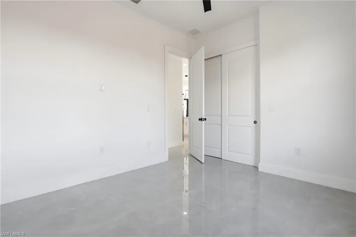 Unfurnished bedroom featuring a closet and a ceiling fan