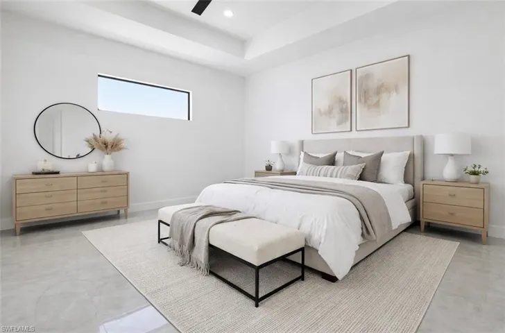 Bedroom with ceiling fan and recessed lighting. Digitally Staged.