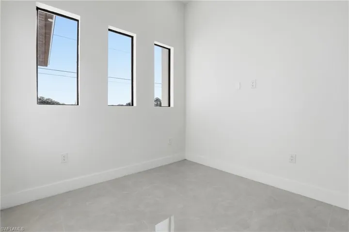 Unfurnished room with baseboards