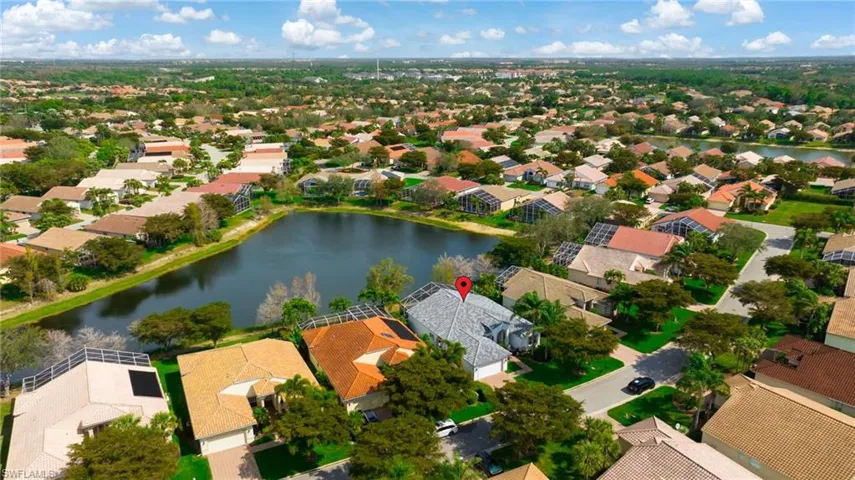 Birds eye view of property with a residential view and a water view