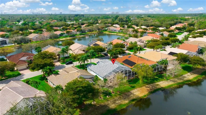 Drone / aerial view with a residential view and a water view
