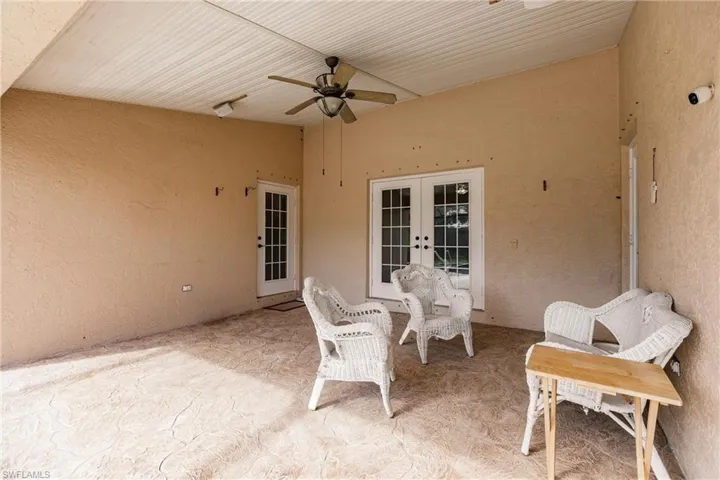 View of patio / terrace with french doors and ceiling fan