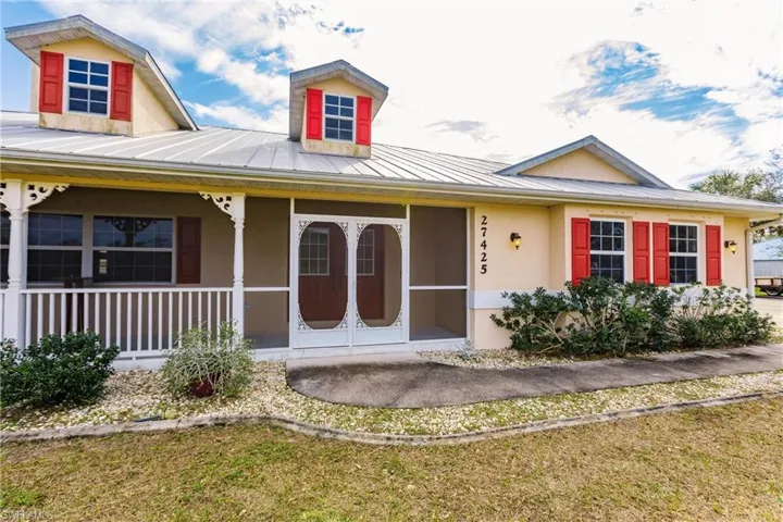View of front of property with a front lawn