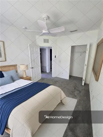 Carpeted bedroom featuring a ceiling fan and visible vents
