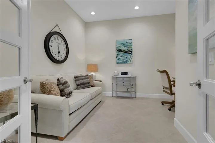 Office area with recessed lighting and light tile patterned flooring