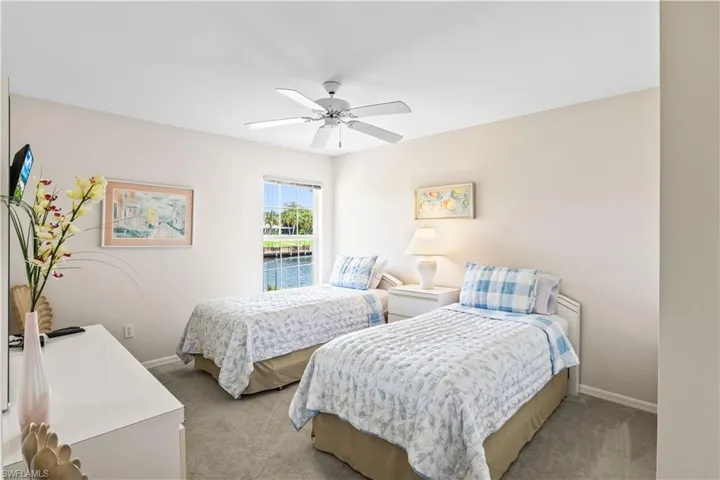 Bedroom featuring carpet floors and ceiling fan