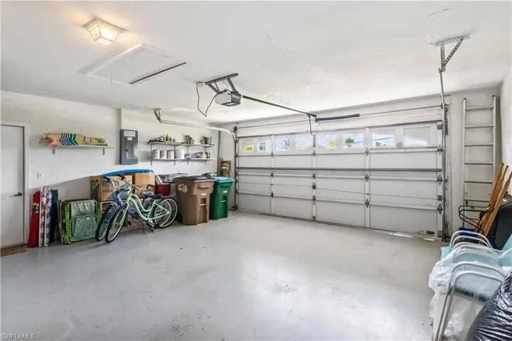 Garage featuring a garage door opener