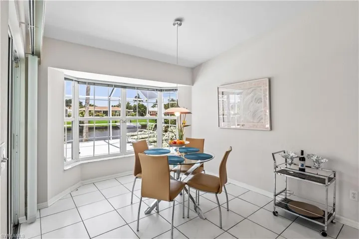Dining space featuring plenty of natural light and light tile floors